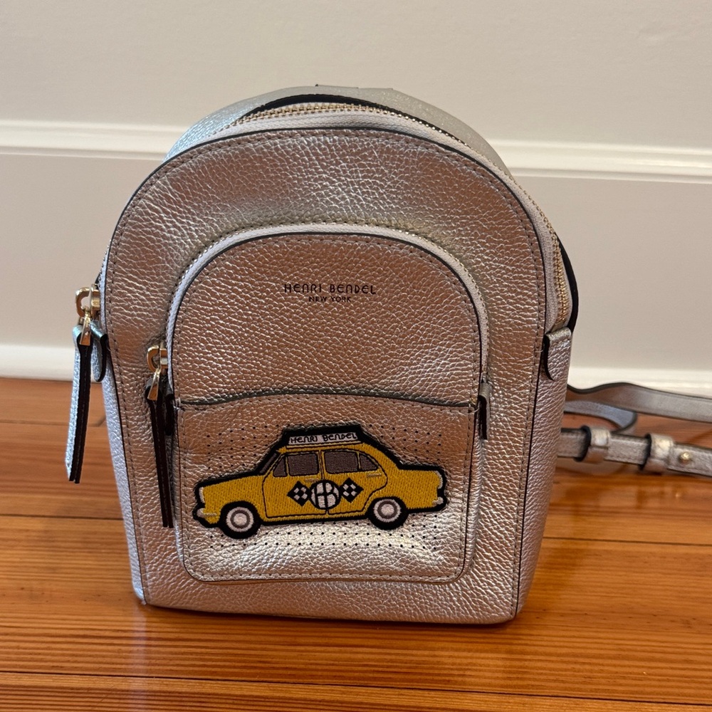 Henri Bendel Metallic Backpack with Yellow Car Design